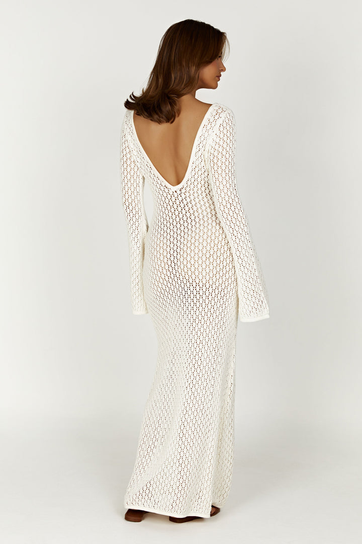 Flowing white maxi dress for women, featuring elegant wide sleeves. Perfect for holiday vibes and summer fashion.