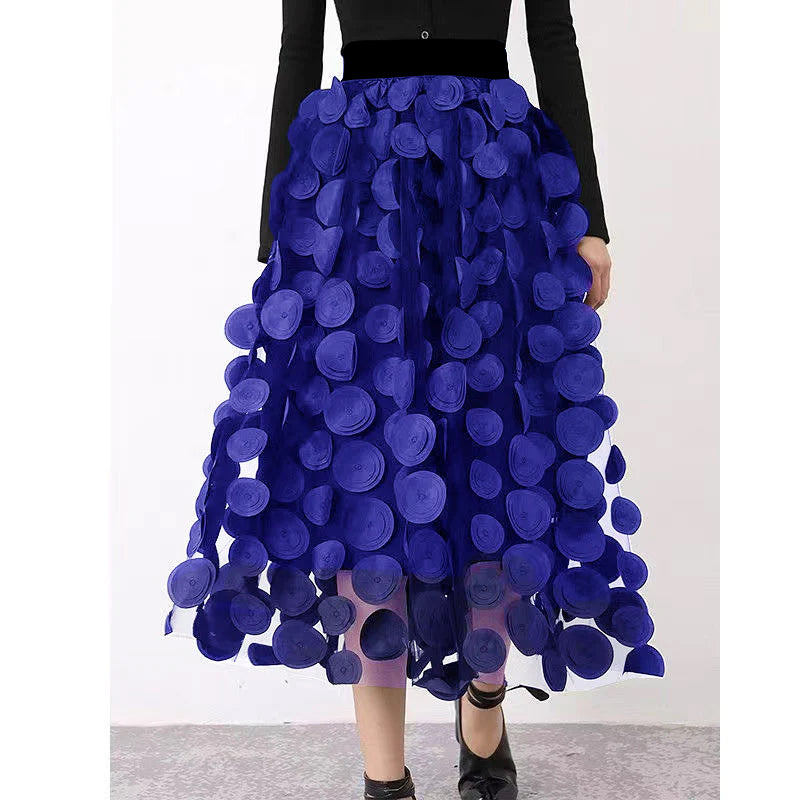 Women's elegant polka dot patchwork maxi skirt styled with a top, perfect for chic versatile fashion.