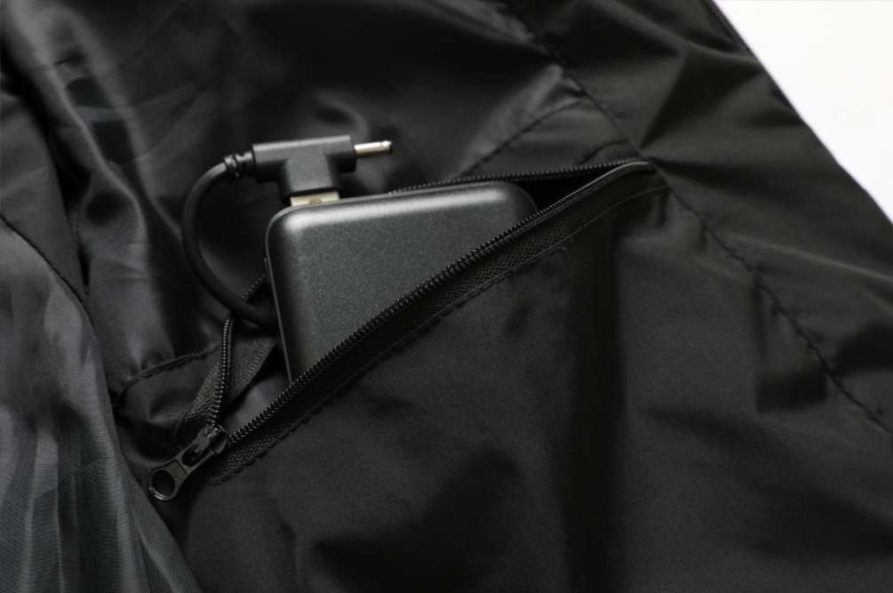 Sleek black unisex heated jacket, water-repellent & lightweight, perfect for winter wear.