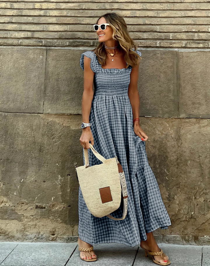Versatile smocked maxi dress for women, offering effortless style from casual to elegant fashion.
