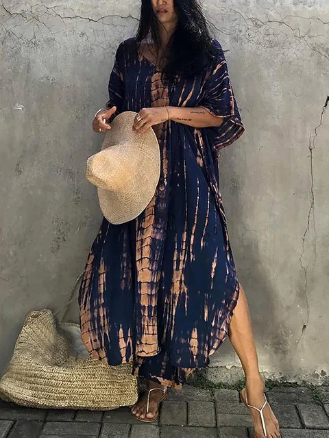 Vibrant patterned women's flowy caftan maxi dress, perfect for eye-catching summer looks.