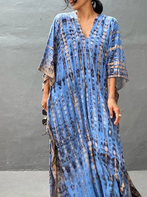 Elegant women's patterned caftan maxi dress for resort wear, vacation, and beach style.
