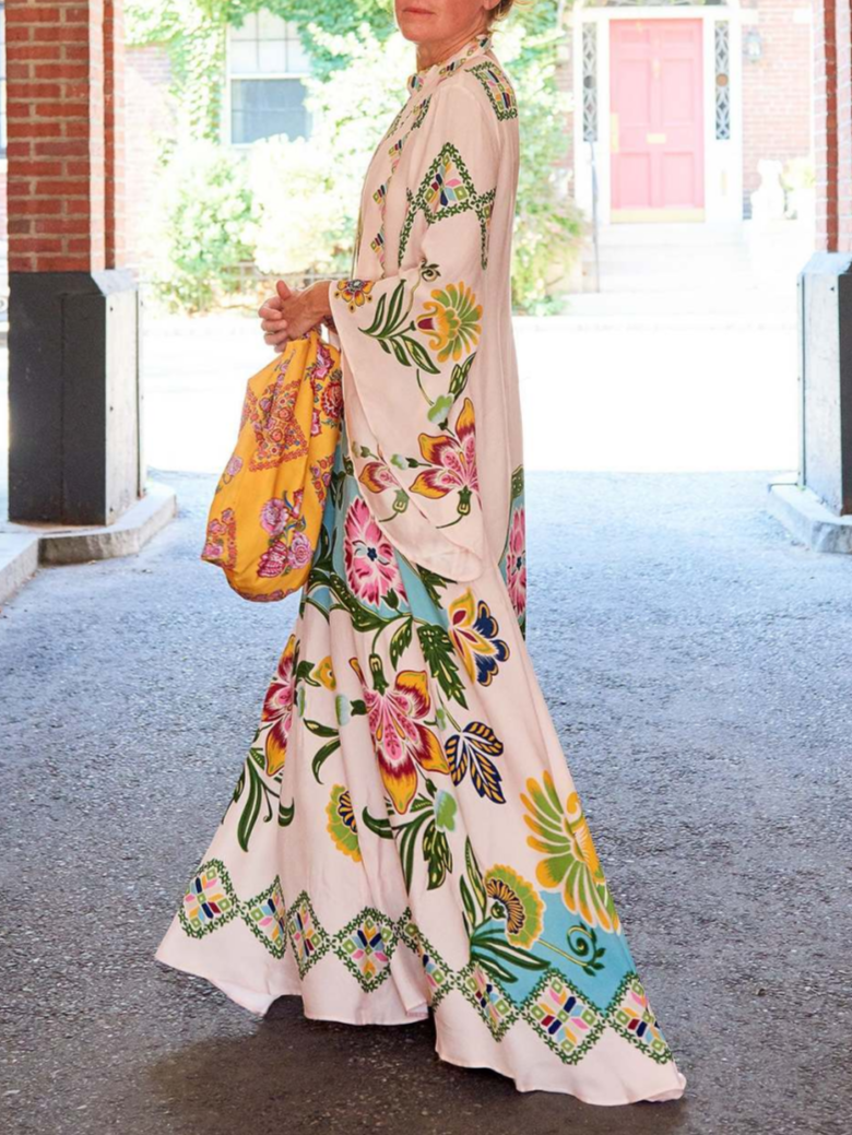 Women's elegant long sleeve floral maxi dress in cream, a flowy design perfect for summer and special occasions.