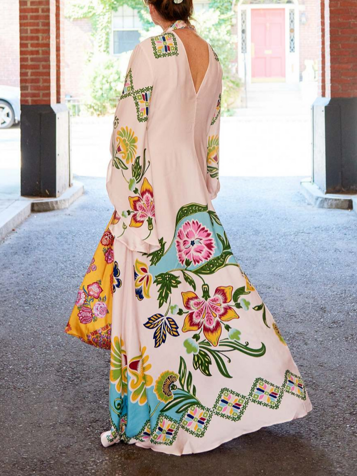 Graceful women's cream floral maxi dress, a long sleeve flowy design offering elegant style for summer events.