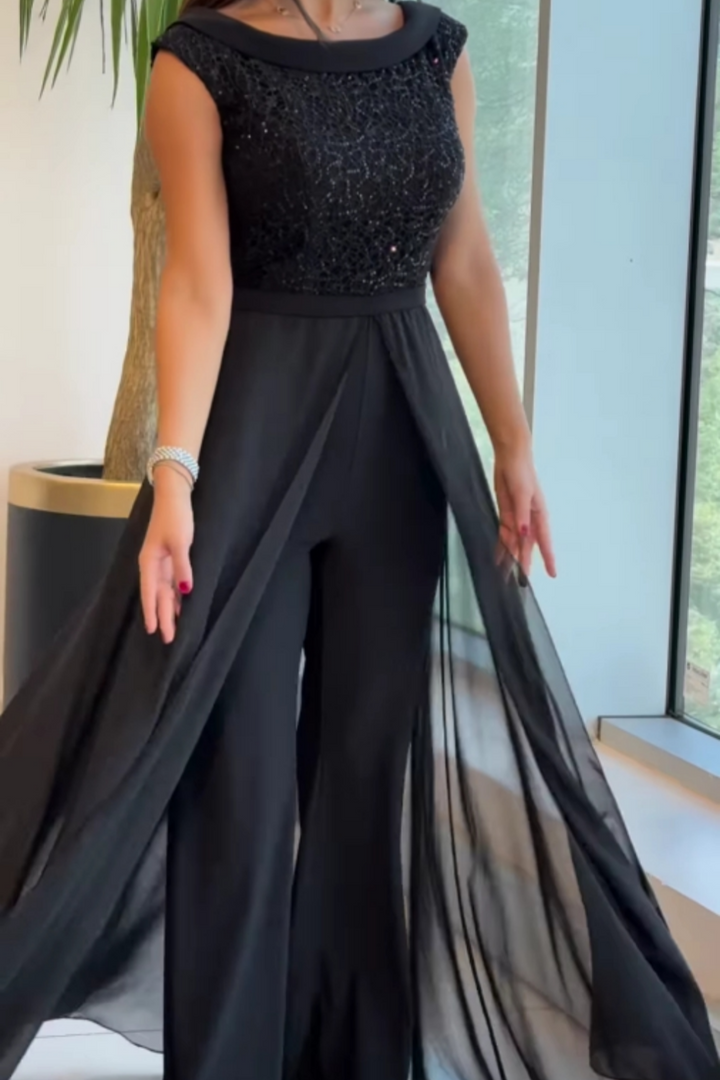 Stylish women's one-piece black jumpsuit with a sequin bodice & sleeveless design, great for evening events.
