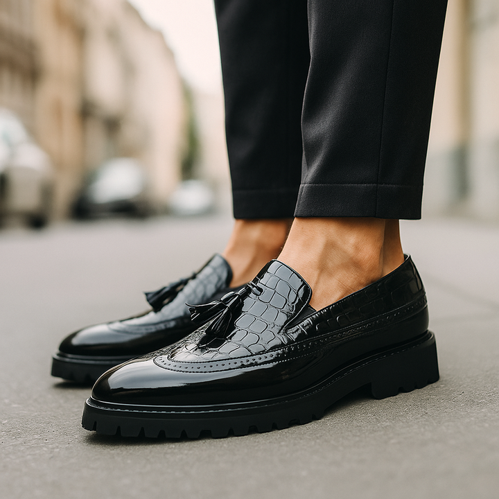 Luxury men's footwear: sophisticated croc-embossed tassel loafers for a polished and elegant look.