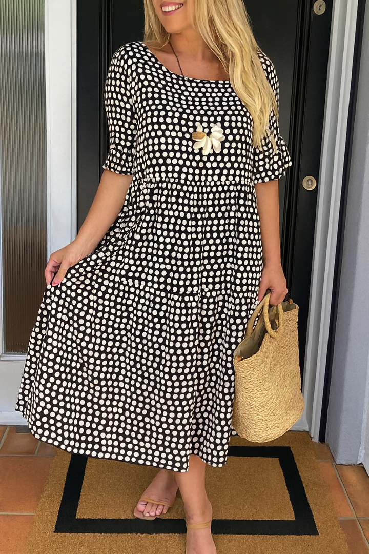 Classic black short-sleeve midi dress for women. Elegant round neck design.
