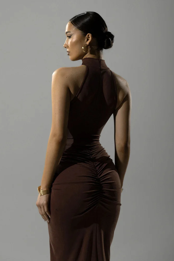 Stylish & comfortable women's ruched maxi dress with halter neck & slit, ideal for special occasions.