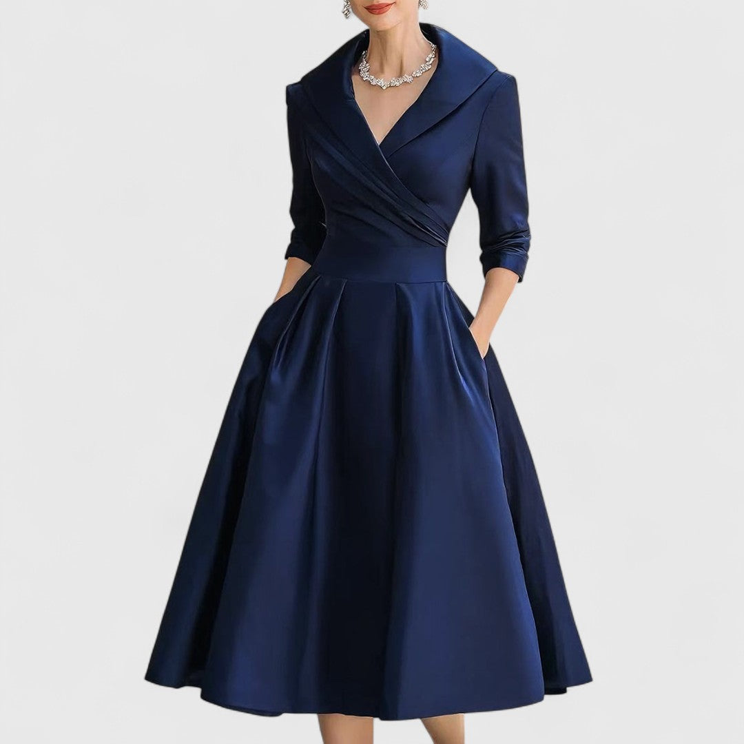 Women's elegant midi dress with flattering fit, V-neck, 3/4 sleeves, & practical pockets.