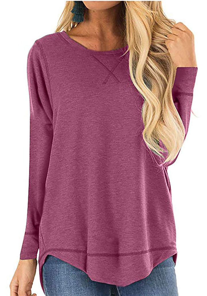 Fashionable women's long sleeve shirt with prominent side slits, offering a modern casual look.