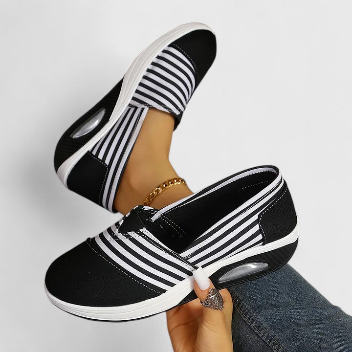 Supportive women's orthopedic walking shoes, combining comfort with a modern, casual design.