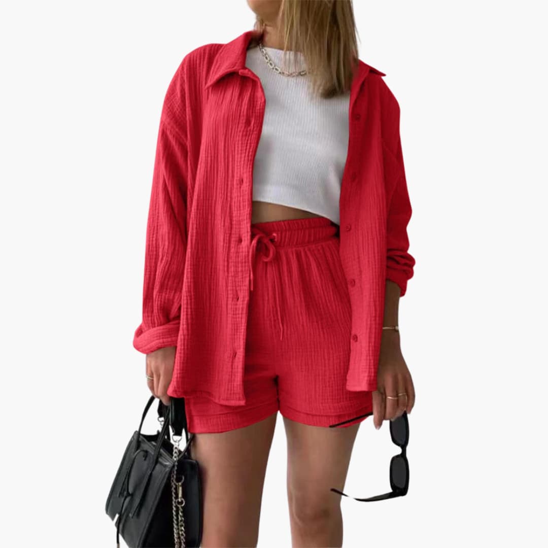Back view of women's stylish three-piece set with a relaxed shirt, crop top, and casual high-waist shorts.