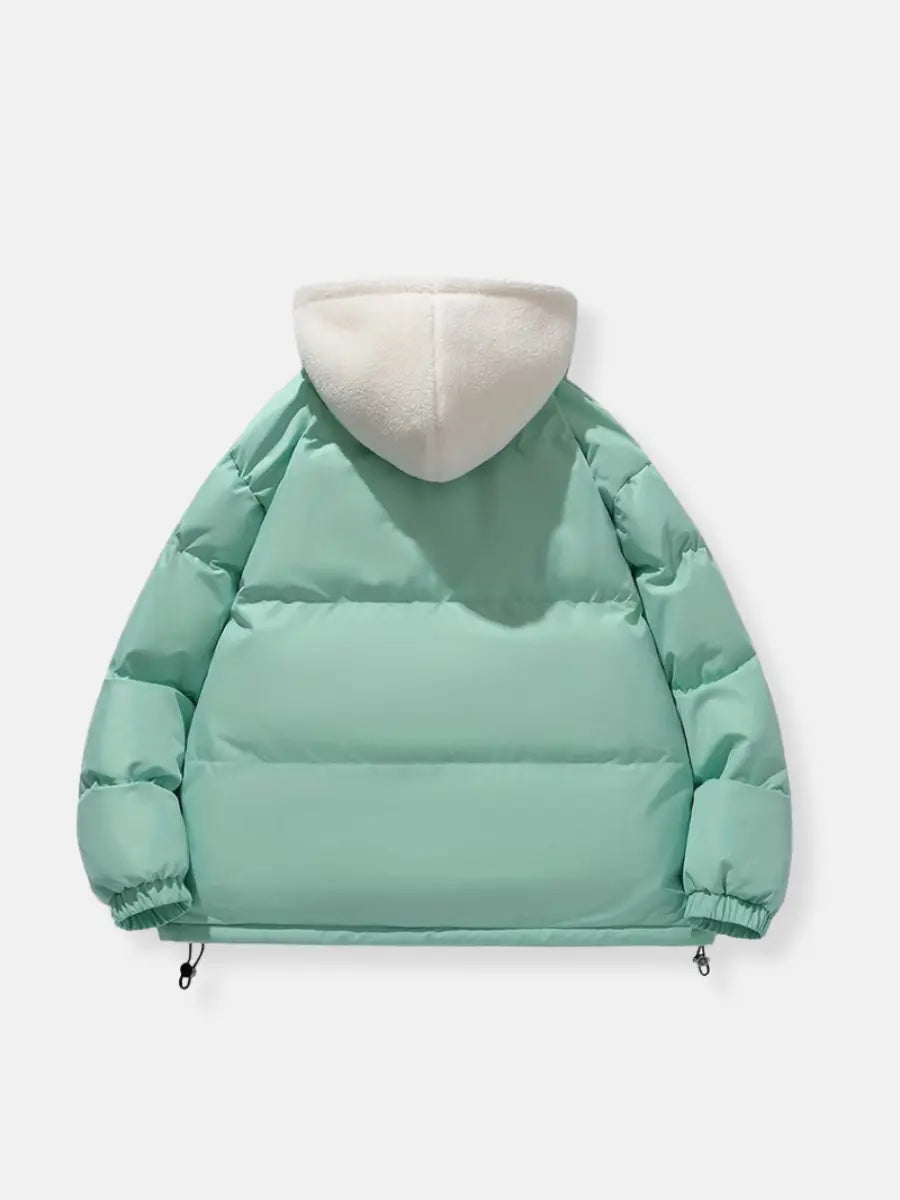 Comfortable women's hooded puffer jacket, ideal for cold weather, travel, & outdoor chic.