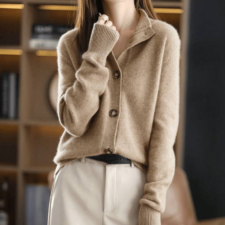 Fashionable long-sleeve women's sweater cardigan. Soft fabric for elegant layering & comfortable wear.