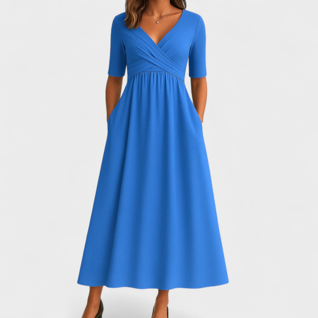 Timeless women's V-neck midi dress with pockets, ideal for a chic and comfortable workday outfit.