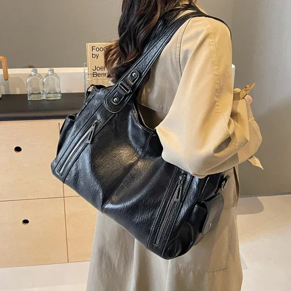 Women's black faux leather tote shoulder bag, perfect for everyday use. Stylish & practical vegan handbag.