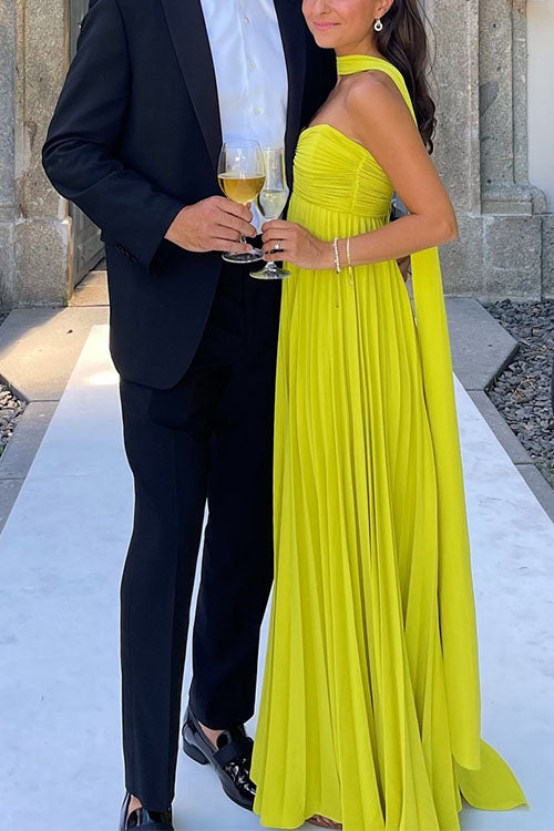 Chic yellow off-shoulder maxi dress for women. Elegant design with lacing detail and beautiful pleated skirt for evenings.