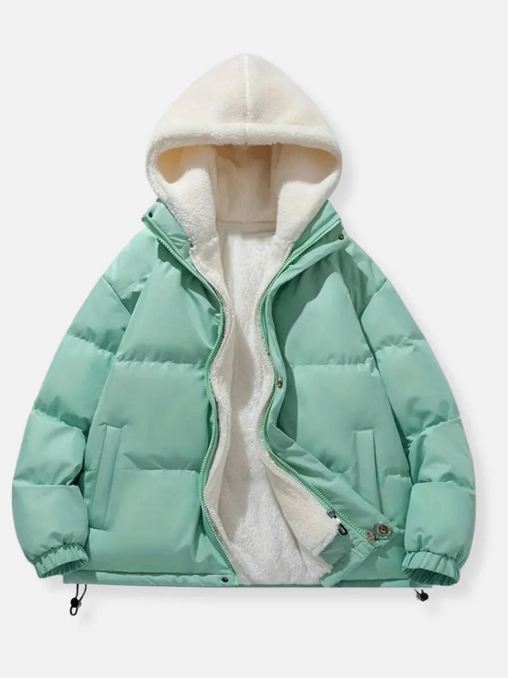 Fashionable women's winter puffer jacket in navy, with a plush hood for ultimate warmth & style.