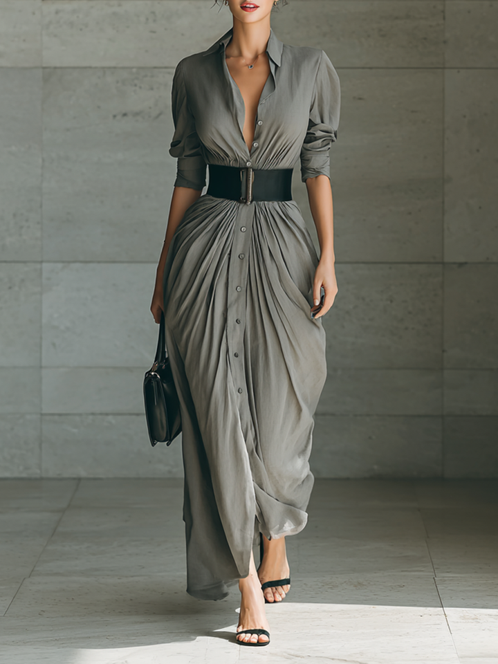 Women's elegant pleated long grey dress with a stylish belt. Perfect for evening, party, or formal wear.