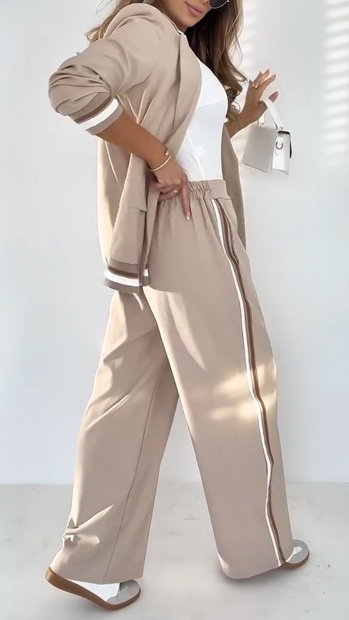 Modern women's striped lapel jacket and pant suit. Perfect for a chic office look.