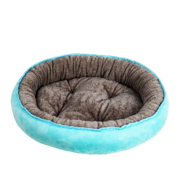 Washable round pet bed in plush grey, offering ultimate comfort for dogs & cats. Cozy & relaxing anxiety relief.