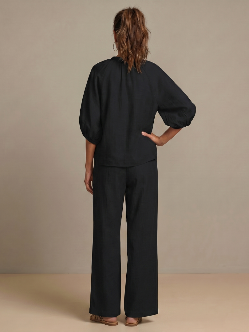Modern women's blouse pants set: zip front blouson top & wide leg pants. A key spring fashion item.
