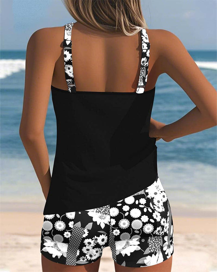 Summer-ready women's printed swimsuit set. Stylish tank top & comfy shorts for beachwear.