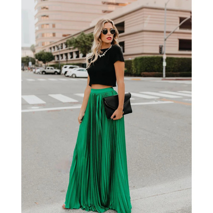 Flowy women's pleated midi skirt, versatile for casual or formal wear, high-waisted.