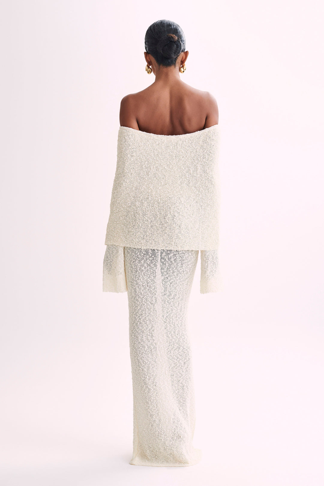 Sophisticated long sleeve off-shoulder maxi dress for women, ideal for elegant evening wear.