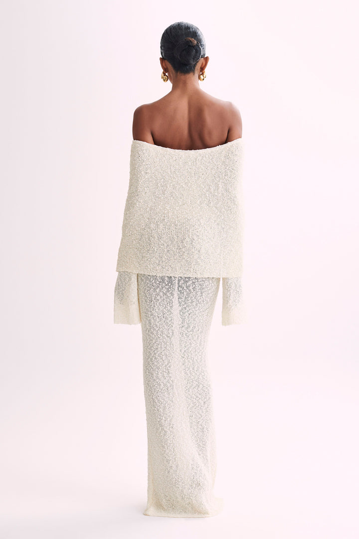 Sophisticated long sleeve off-shoulder maxi dress for women, ideal for elegant evening wear.