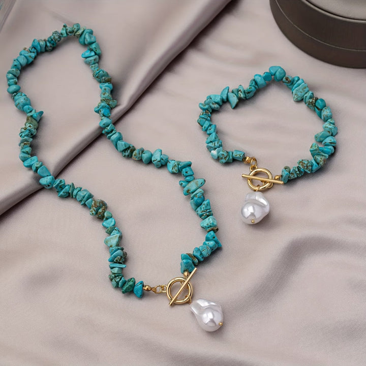 Vibrant turquoise and pearl necklace and bracelet set for women. Fashionable, elegant jewelry accessory.