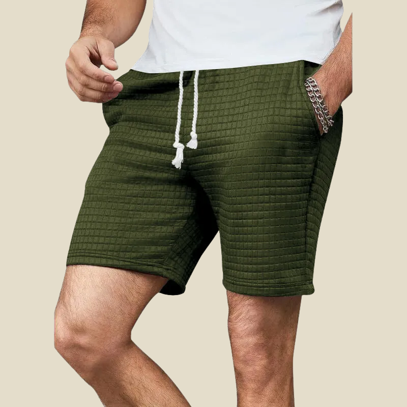 Textured waffle-knit men's shorts in blue, ideal for casual wear & weekend style. Comfortable, relaxed fit shorts.