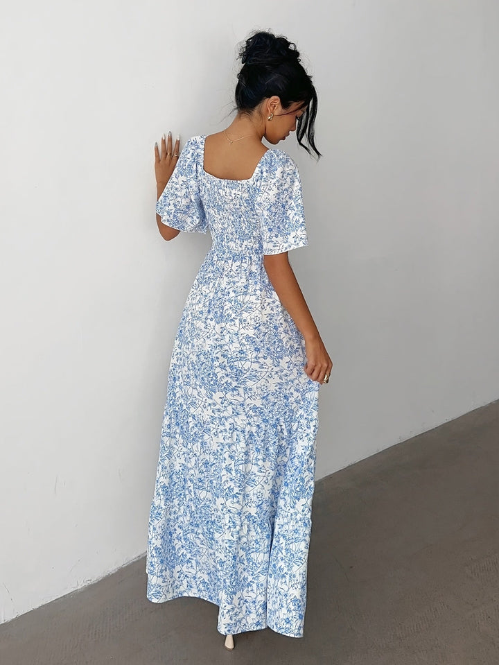 Beautiful women's floral summer dress with a tiered skirt & sweetheart neckline, ideal for events.