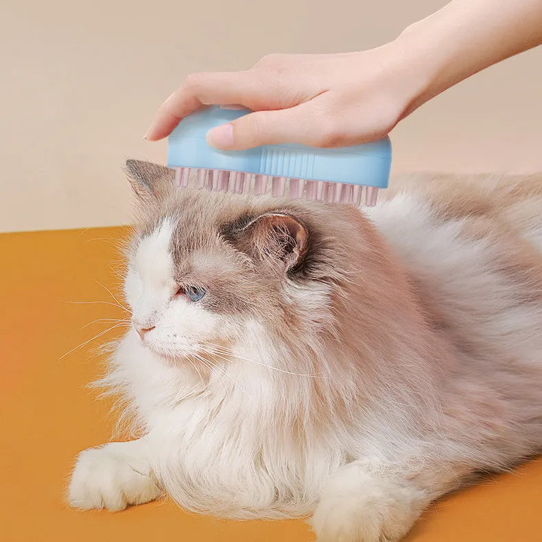 Electric cat grooming brush with massage & soap dispenser for gentle pet care.