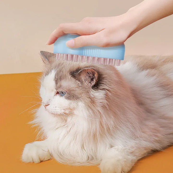 Electric cat grooming brush with massage & soap dispenser for gentle pet care.