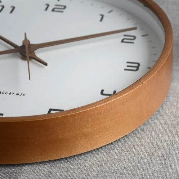 Silent minimalist wall clock with elegant wooden frame & clear face. Perfect for peaceful bedroom or office decor.