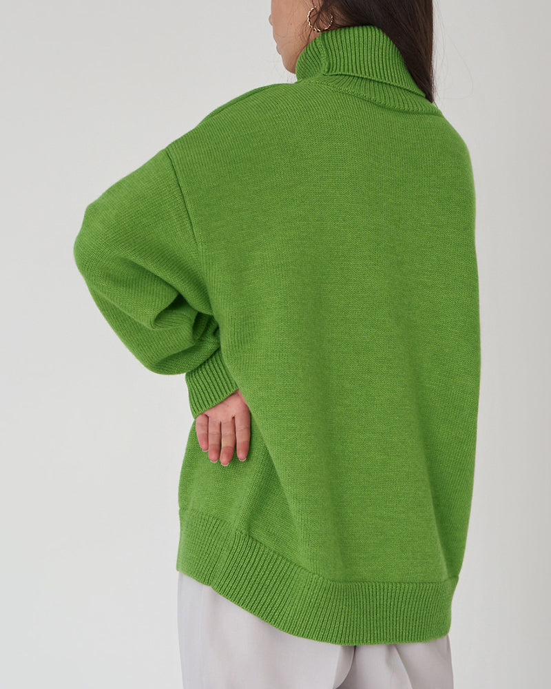 Soft knit women's oversized roll neck jumper, offering cozy comfort and stylish warmth.