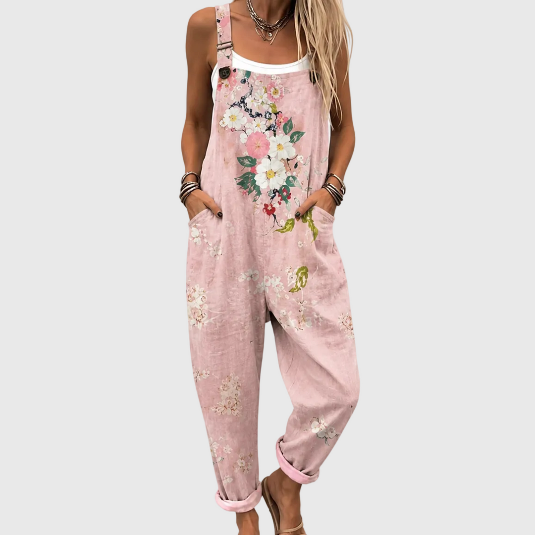 Women's pink floral overalls jumpsuit. Loose fit, comfortable casual wear for summer. Adjustable straps, pockets.