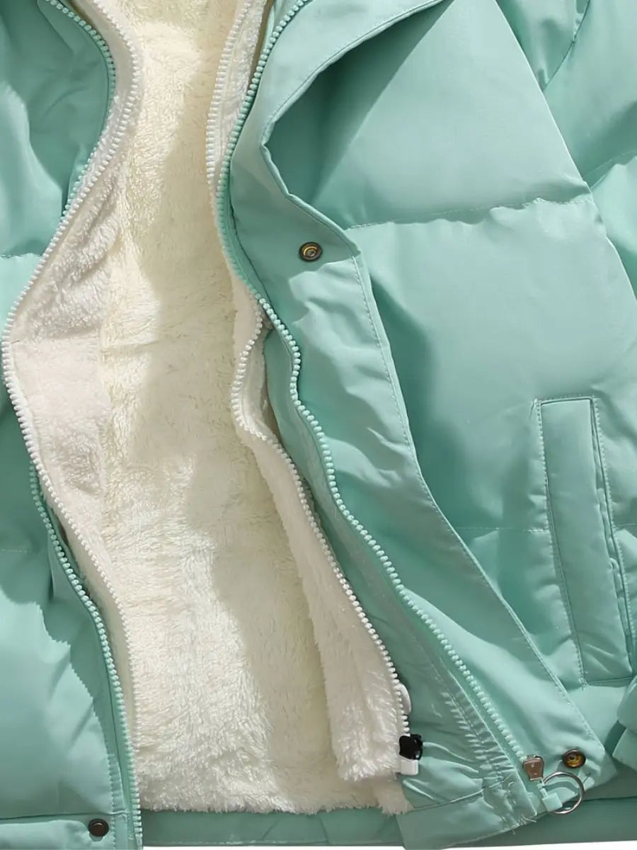 Practical women's cold weather puffer, a warm hooded jacket with plush lining for comfort & style.
