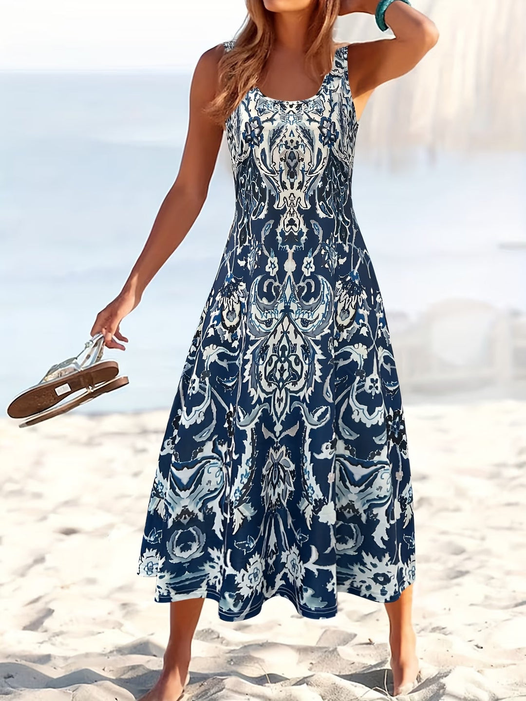 Flowy women's summer midi dress with vibrant floral print. Sleeveless & elegant for warm weather, casual outings.