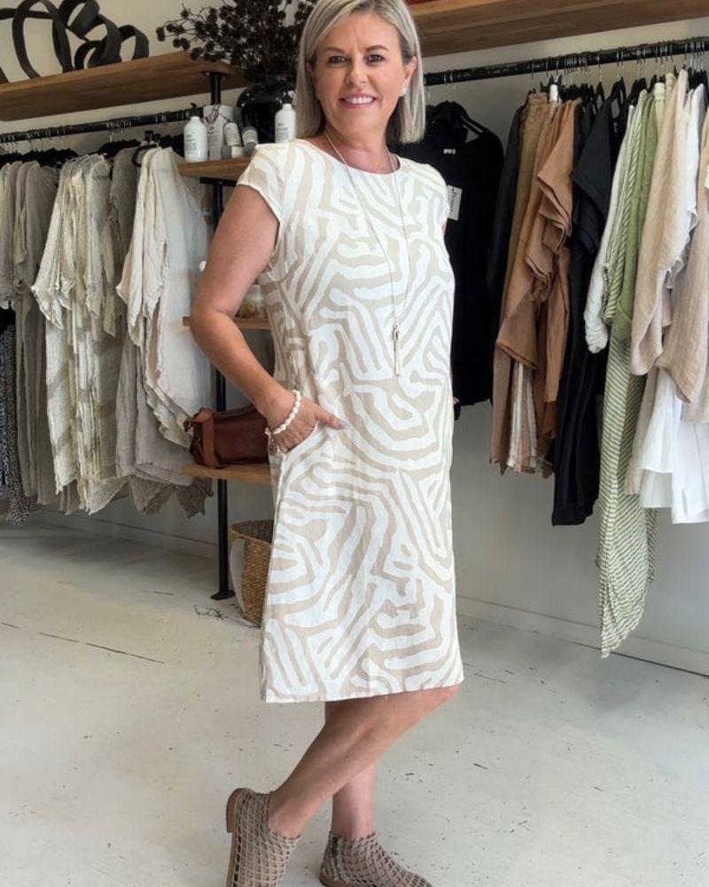 Effortless women's round neck midi dress. A comfortable, casual summer staple for versatile elegant style.