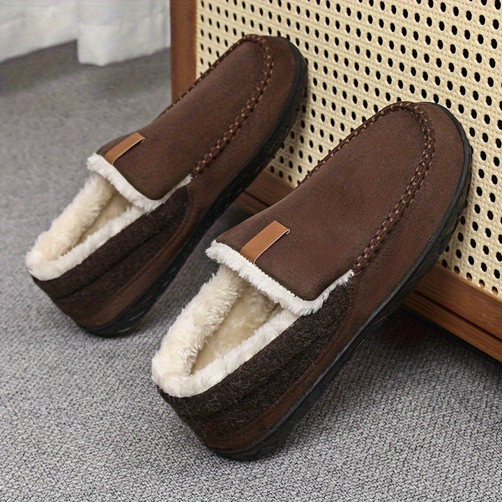 Comfortable men's home wear slippers, perfect for relaxation. Features warm lining & non-slip support.