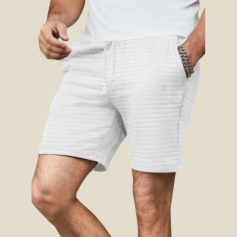 Black men's waffle-knit lounge shorts, offering ultimate comfort & a relaxed fit for casual and weekend style.