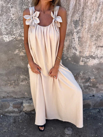Long, elegant women's U-neck maxi dress with pretty bow straps, designed for a flowing, comfortable style.
