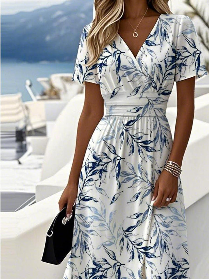 Flattering women's floral leaf print wrap midi dress with V-neck and short sleeves for an elegant, all-season look.