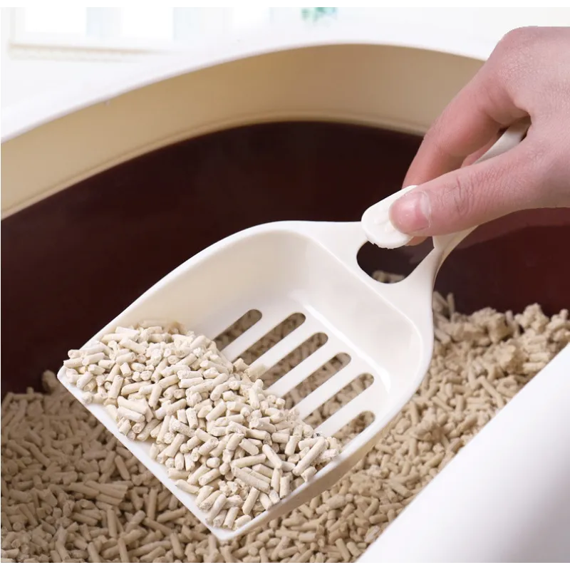 Easy-grip cat litter scoop with a charming cat head design for quick, hygienic litter box cleaning.