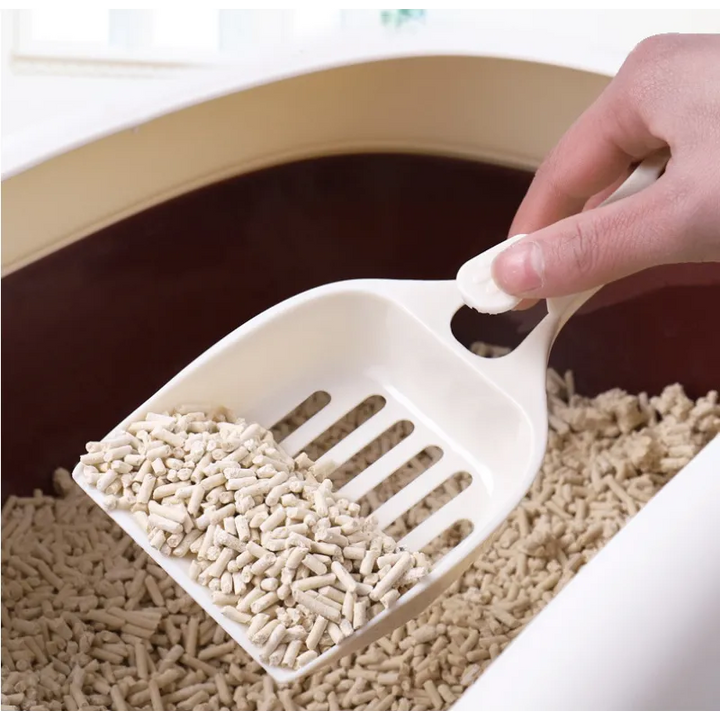 Easy-grip cat litter scoop with a charming cat head design for quick, hygienic litter box cleaning.