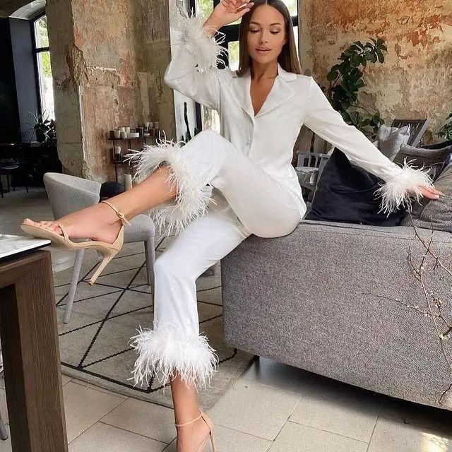 Stylish women's satin pajamas with exquisite feather trim, a chic choice for sleep & lounge.