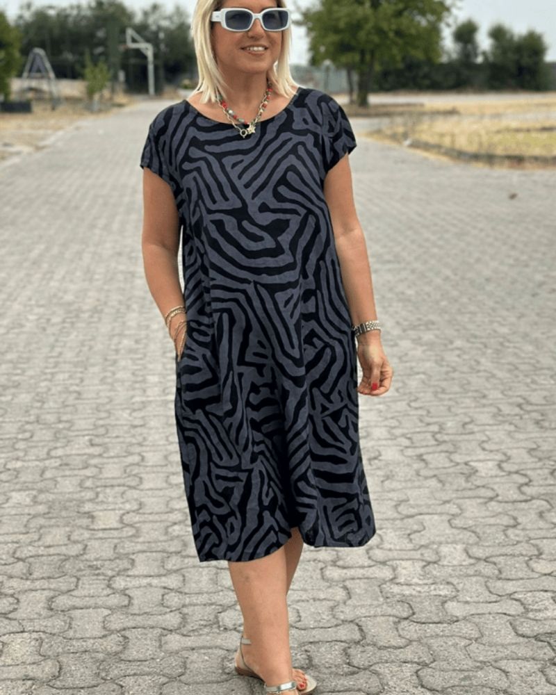 Green women's round neck knee-length summer dress. Effortless style, perfect for day or evening casual comfort.