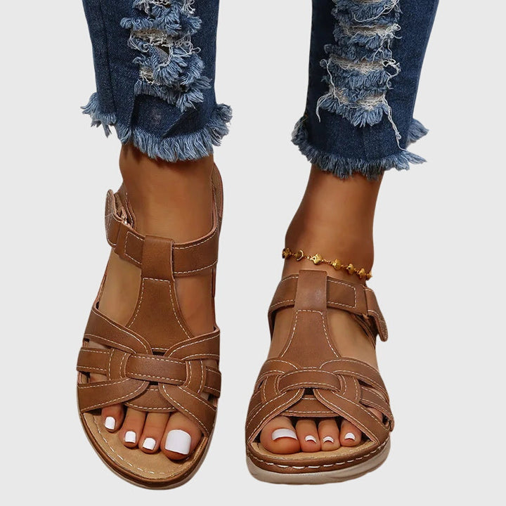 Lightweight women's orthopaedic sandals with adjustable straps, offering comfortable arch support for daily wear.
